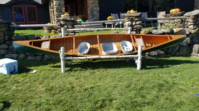 The Canooler, a canoe on a log stand holding iced drinks